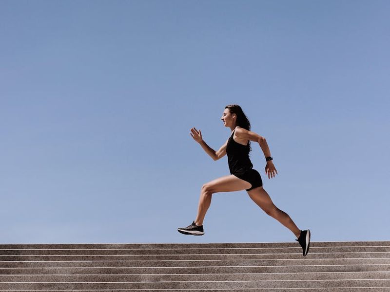 Person in mid-motion during a fluid cardio exercise.